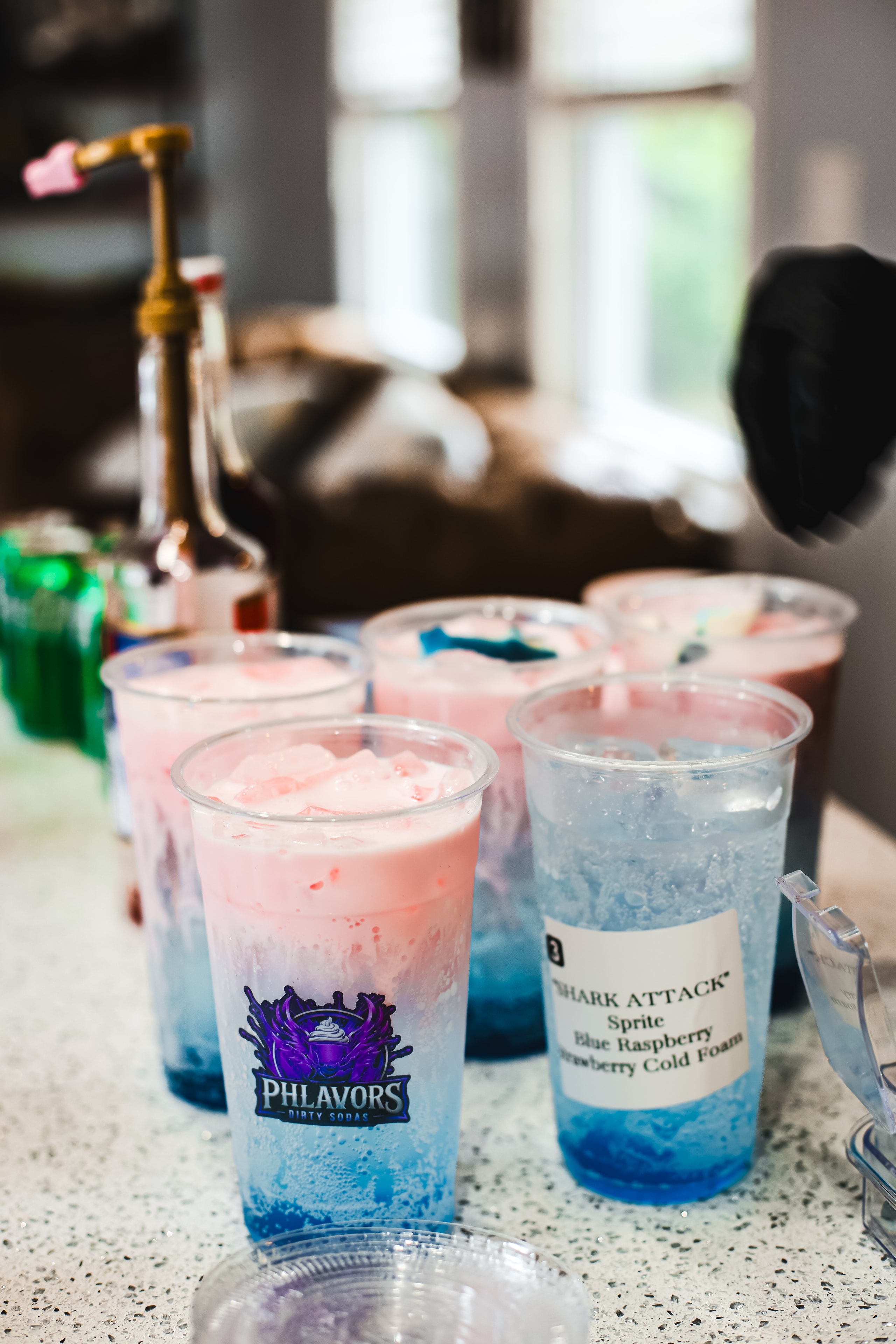 Lineup of Shark Attack dirty sodas in Phlavors cups